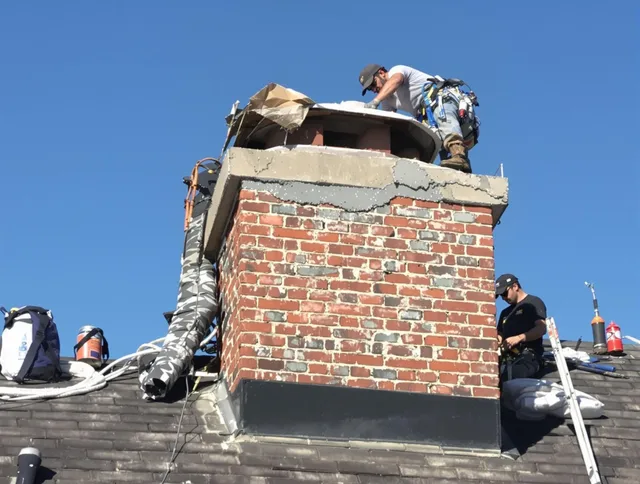 Wareham Chimney Sweep installing a custom chimney crown in Wareham, MA