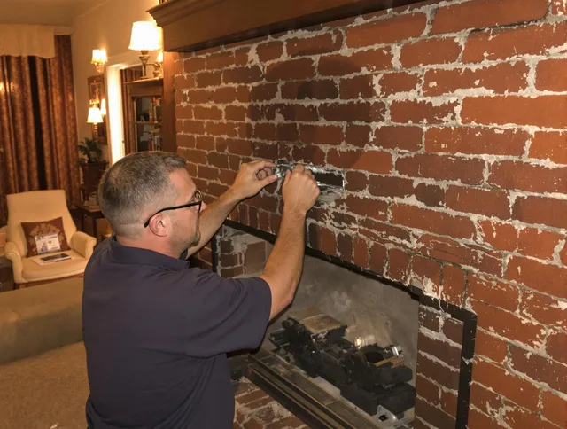 Wareham Chimney Sweep expert fixing a fireplace in Wareham, MA